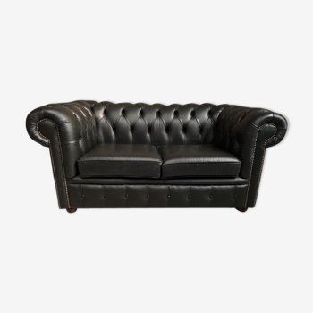 Two seater black leather chesterfield sofa