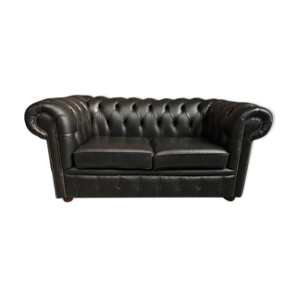 Two seater black leather chesterfield sofa