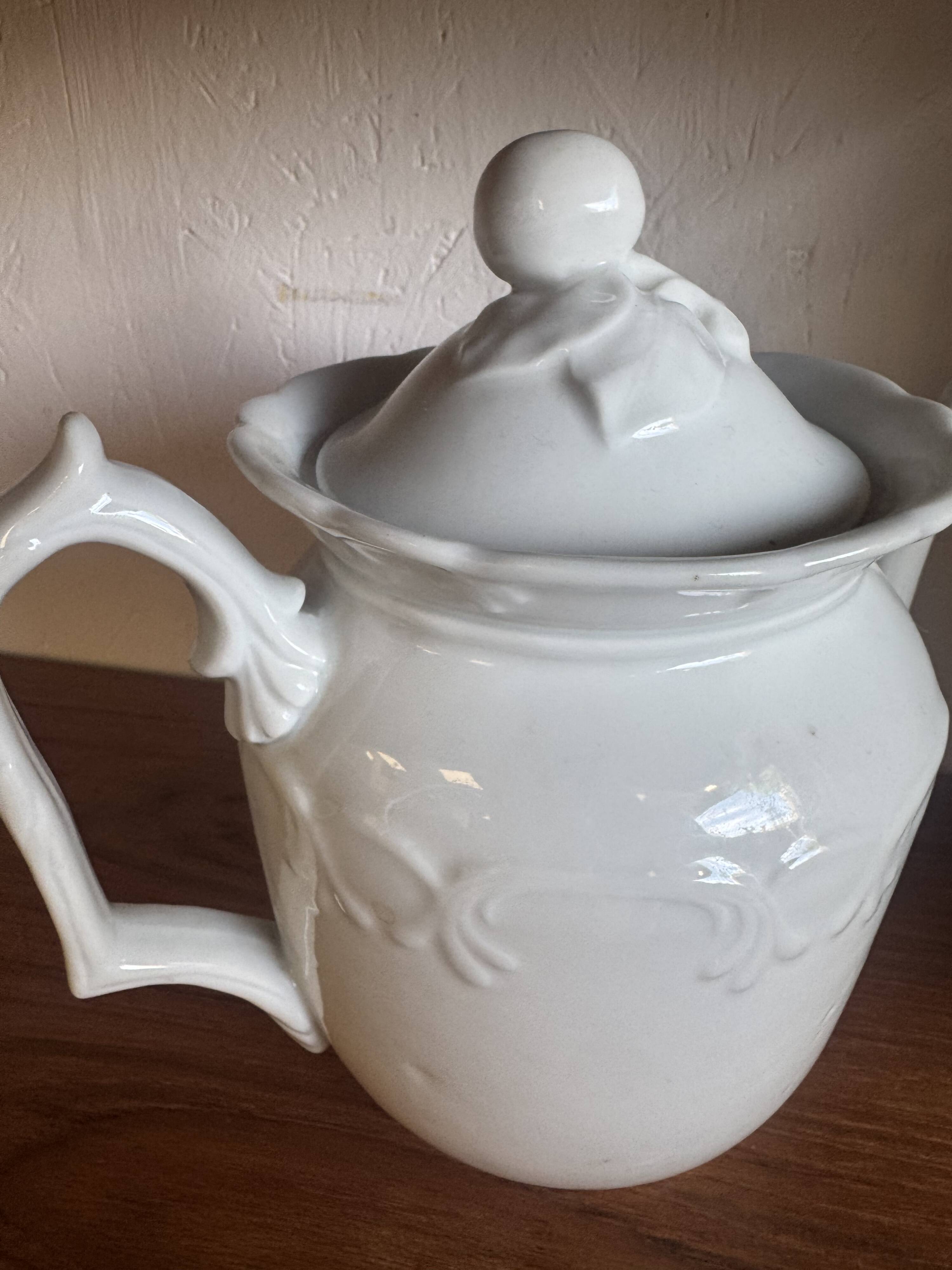 White ceramic teapot