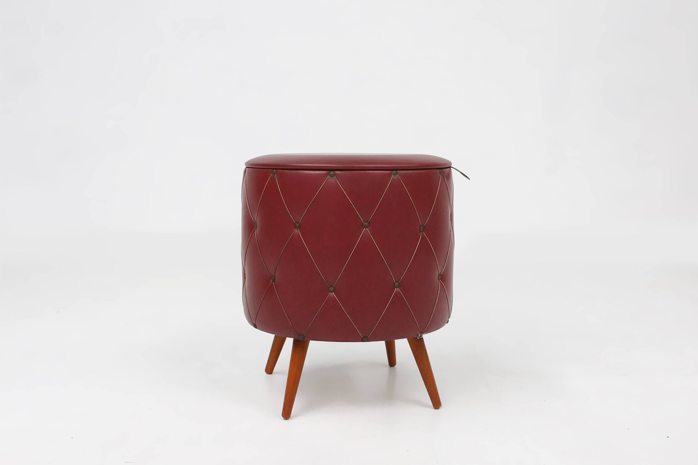 Vintage pouf with storage in dark red faux leather, France ca. 1950