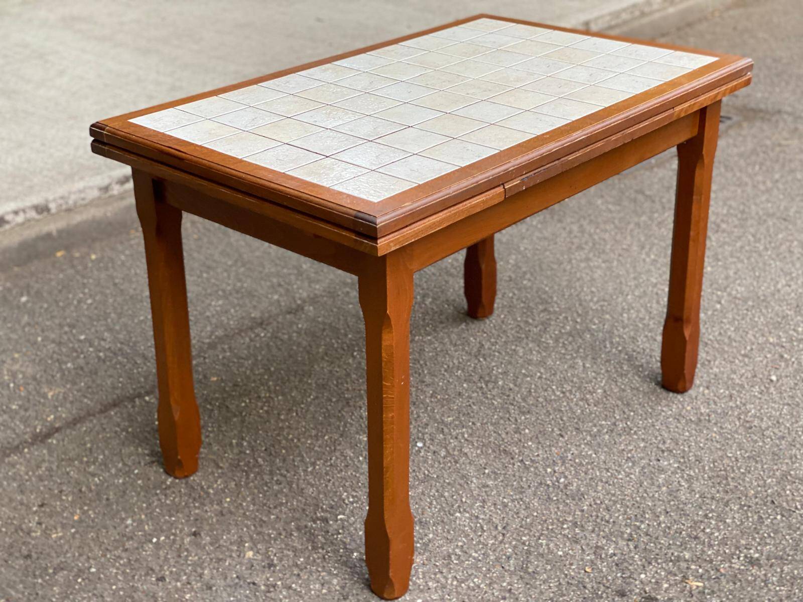 Dining table or farmhouse kitchen style with solid wood and tiles.