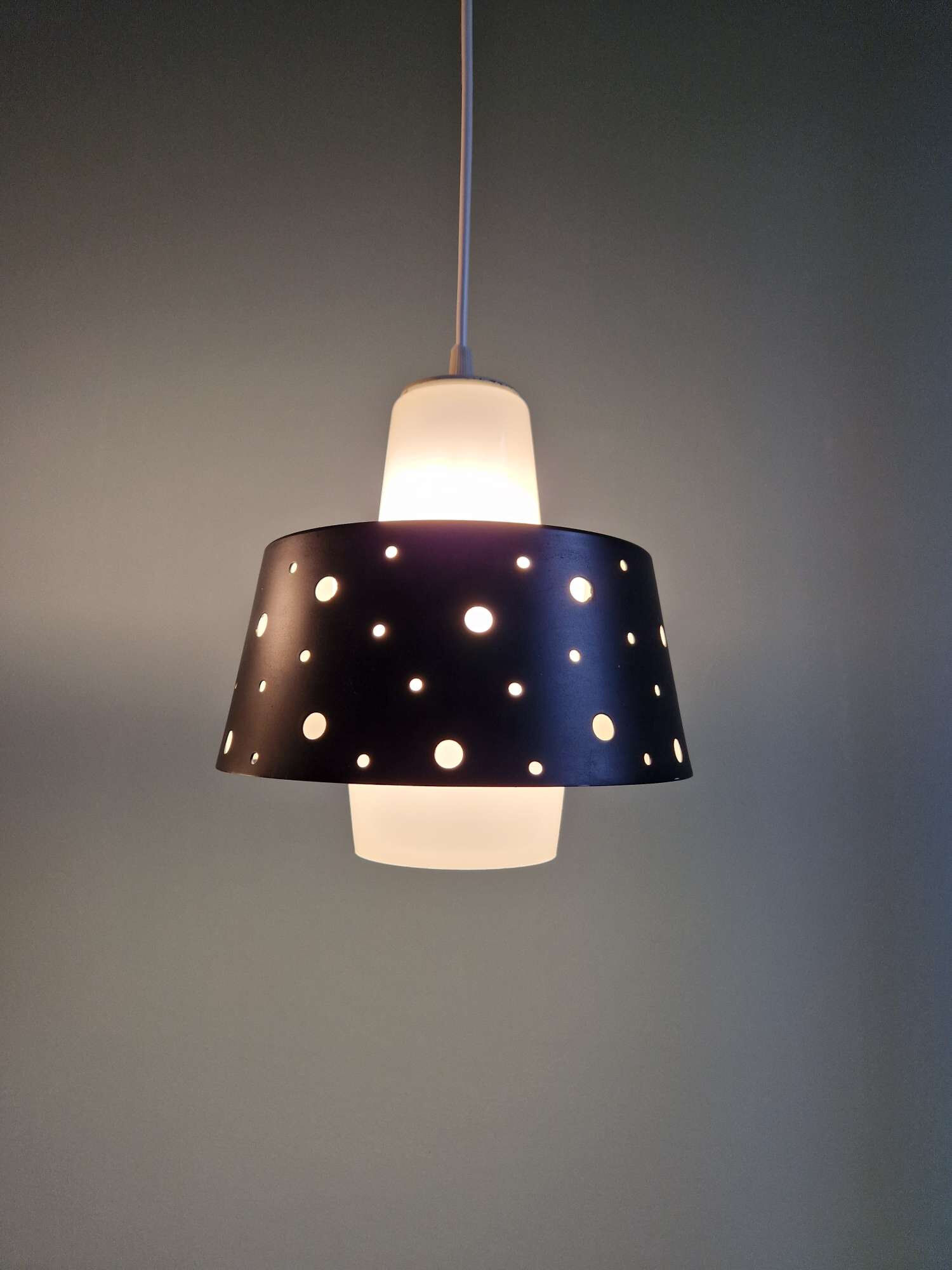 A pair of Scandinavian pendant lights in white opaline and black lacquered metal, 1960.