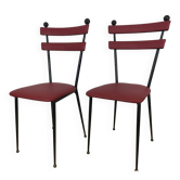 Pair of 1950s chairs in metal and red faux leather, Gueden-Adnet style.