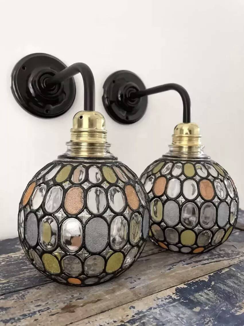 Pair of faceted glass globe wall lights