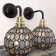 Pair of faceted glass globe wall lights
