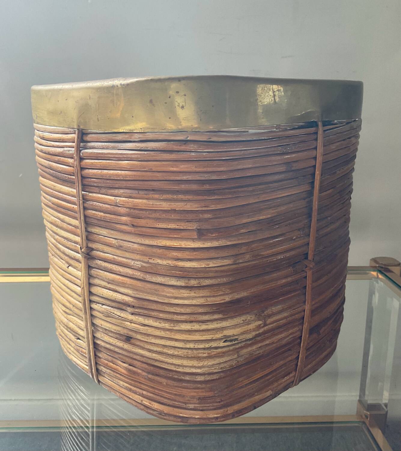 Rattan plant pot rimmed with brass from the 60s and 70s