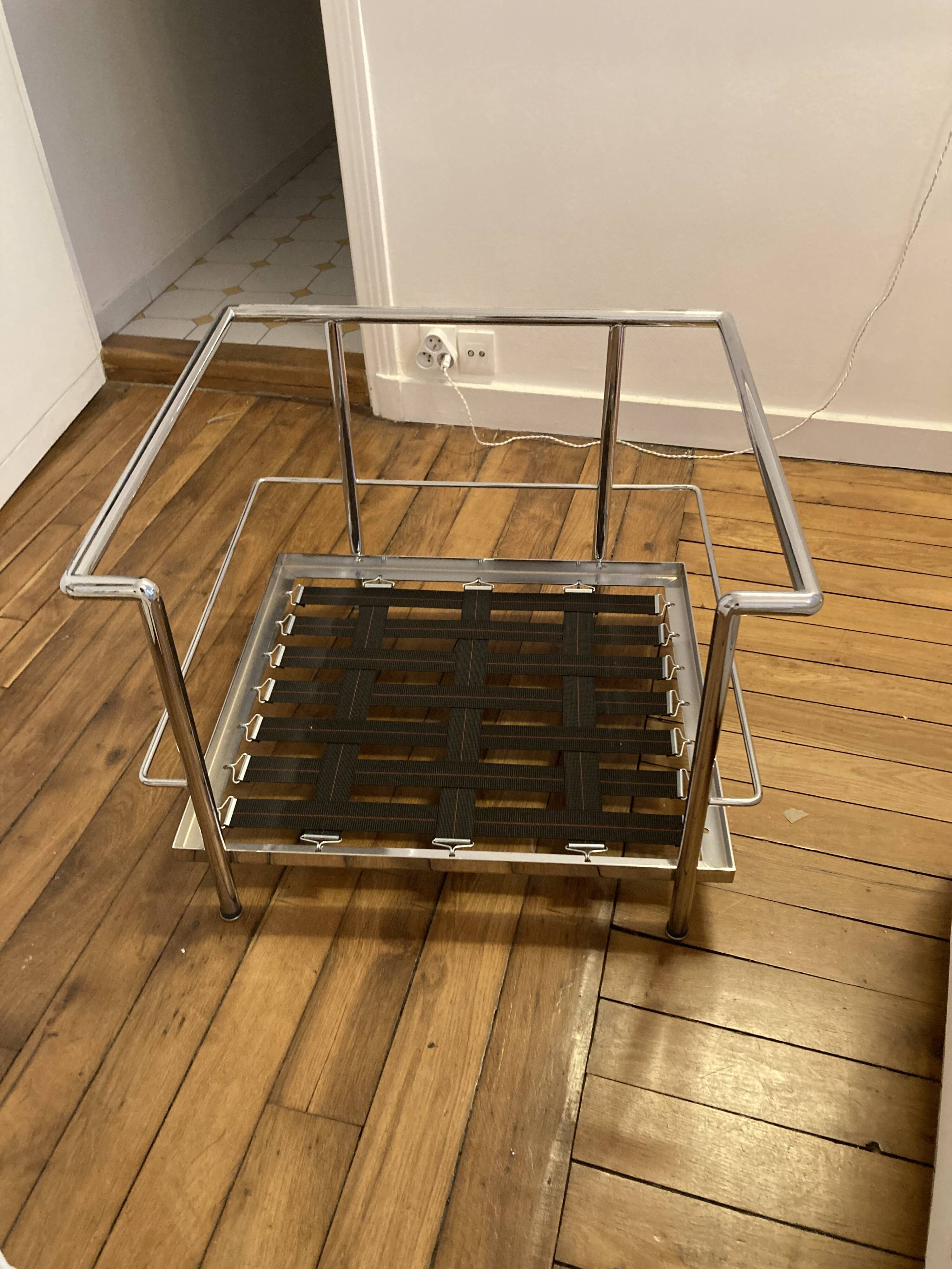 Pair of white leather and chrome armchairs