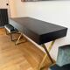 Console desk NV Gallery black wood and brass, 3 drawers.