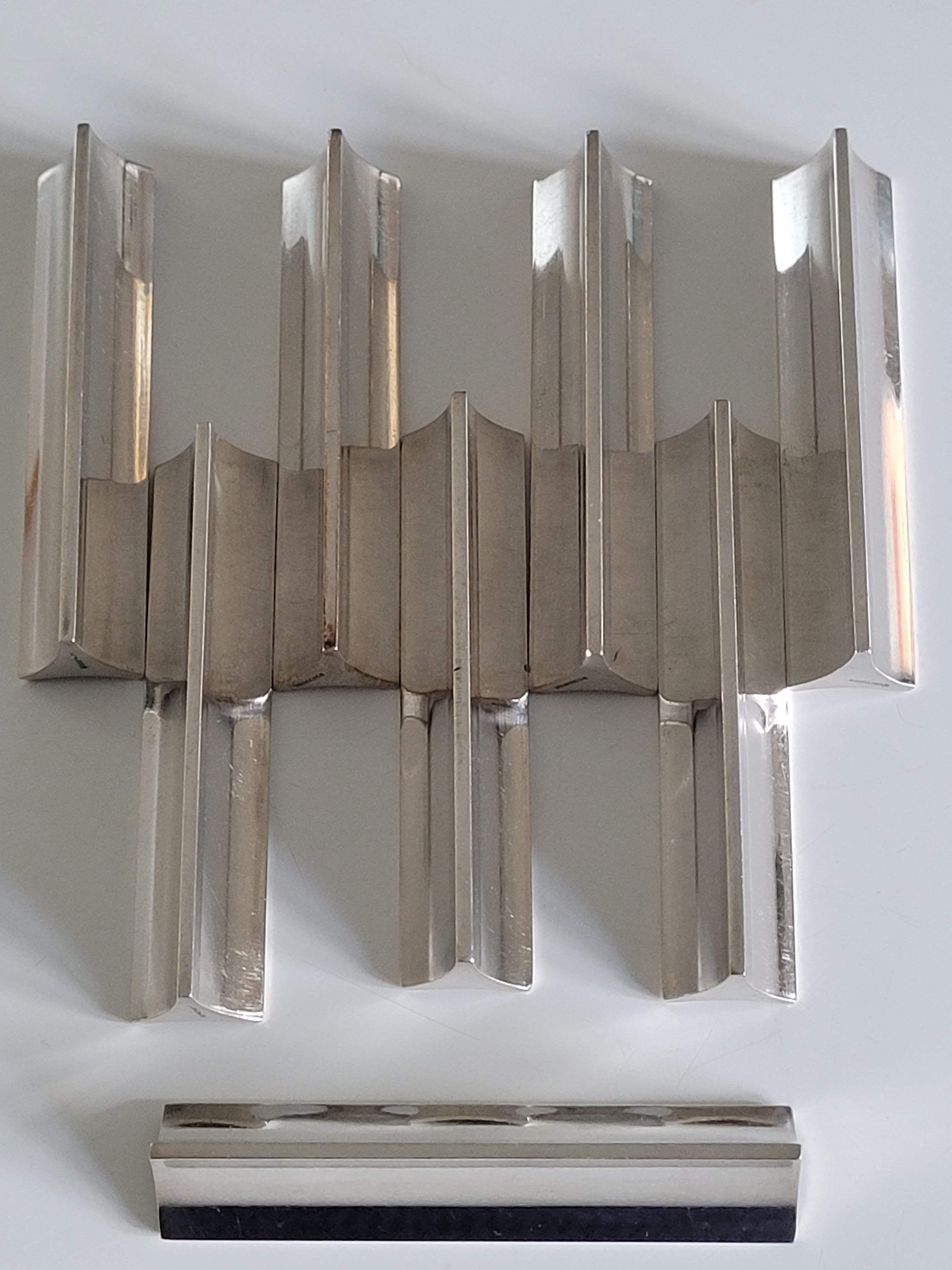 Eight Boulenger knife holders in art deco silver metal