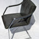Chair with steel and leather armrests