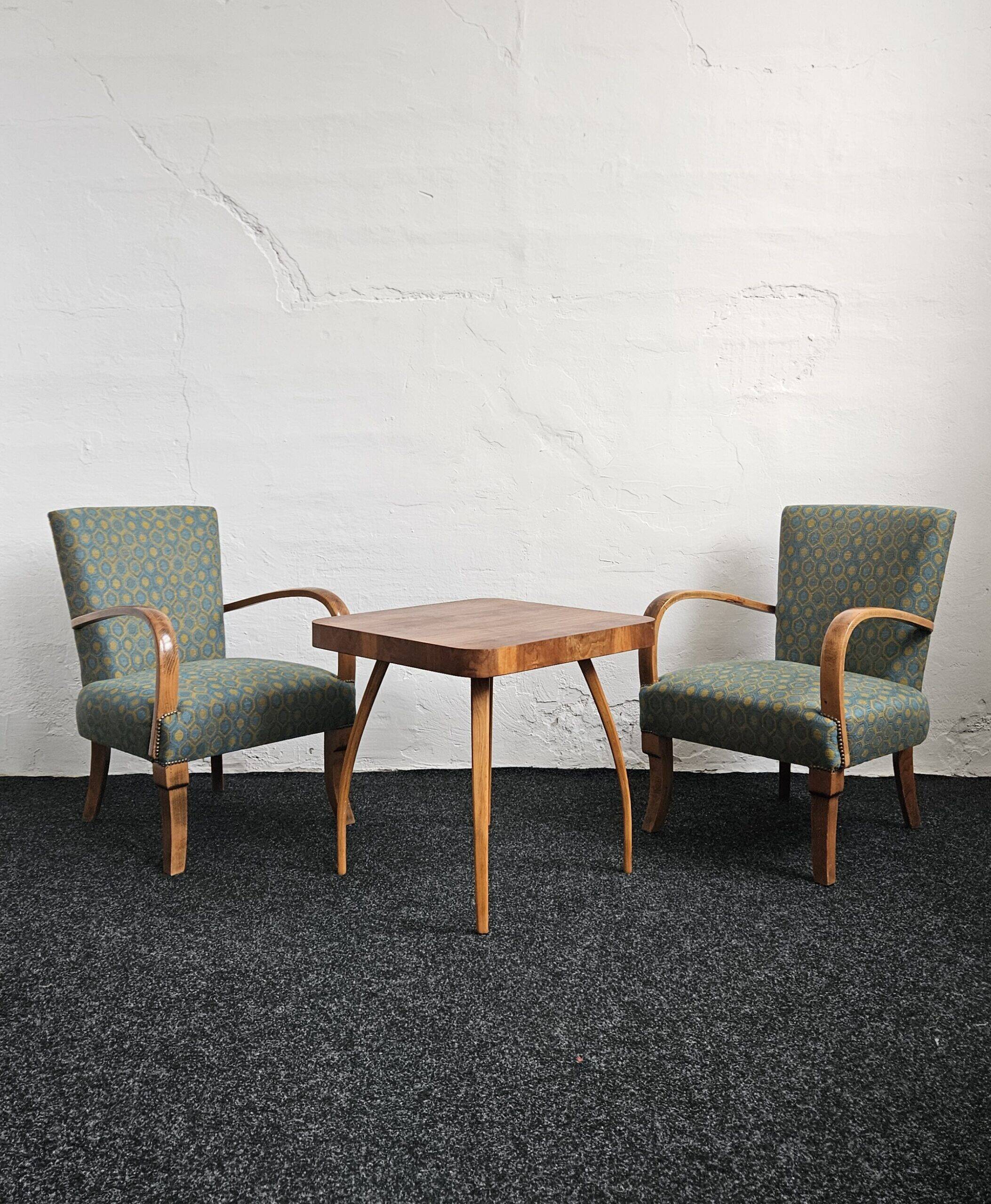 Halabala “Spider” coffee table and Hungarian late Art Deco armchairs, 1950s