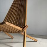 Foldable designer armchair in wooden slats