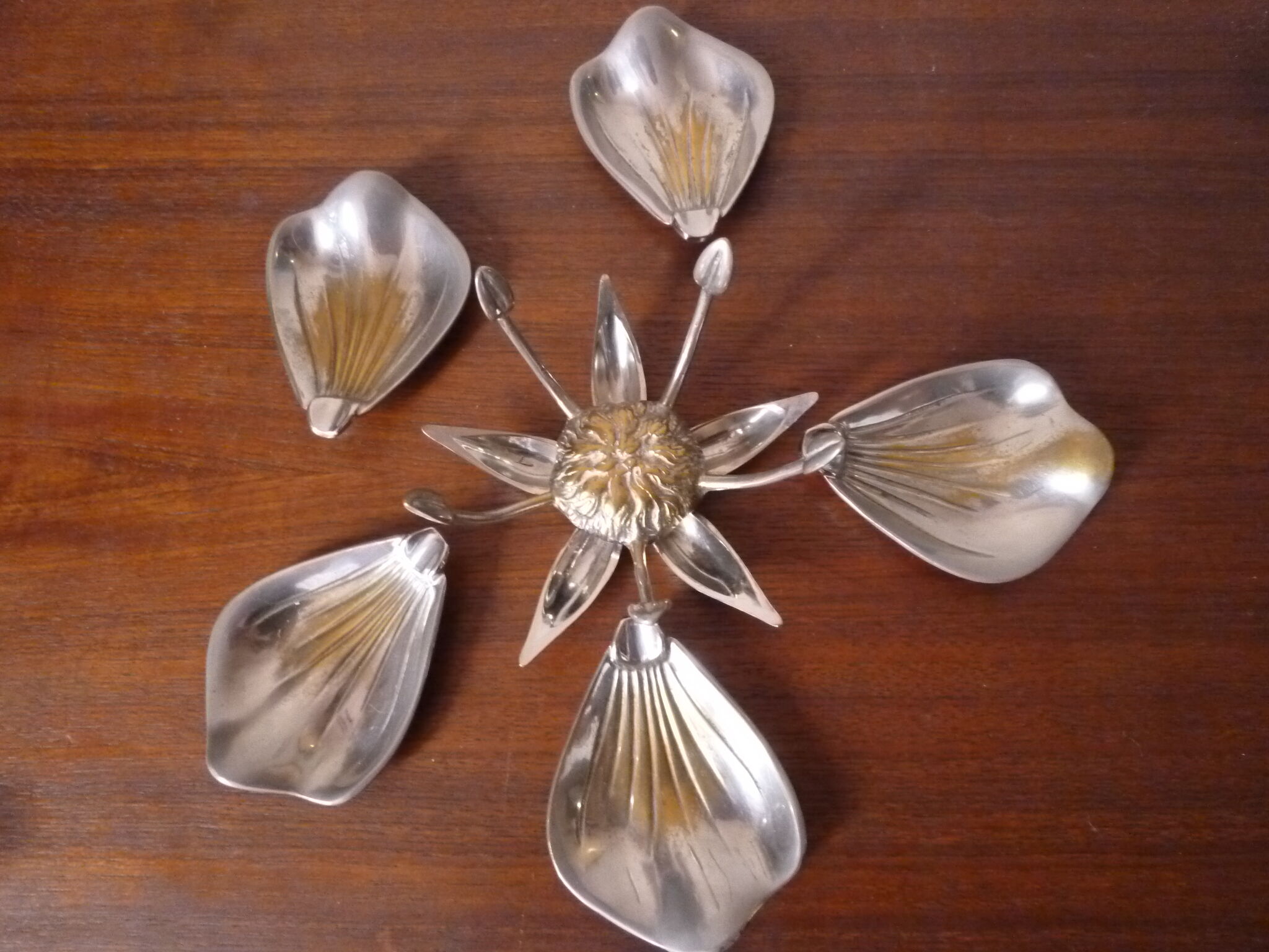 Individual ashtrays on decorative metal flower