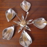 Individual ashtrays on decorative metal flower