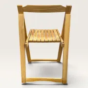 Blonde wooden folding chair in the style of Aldo Jacober.
