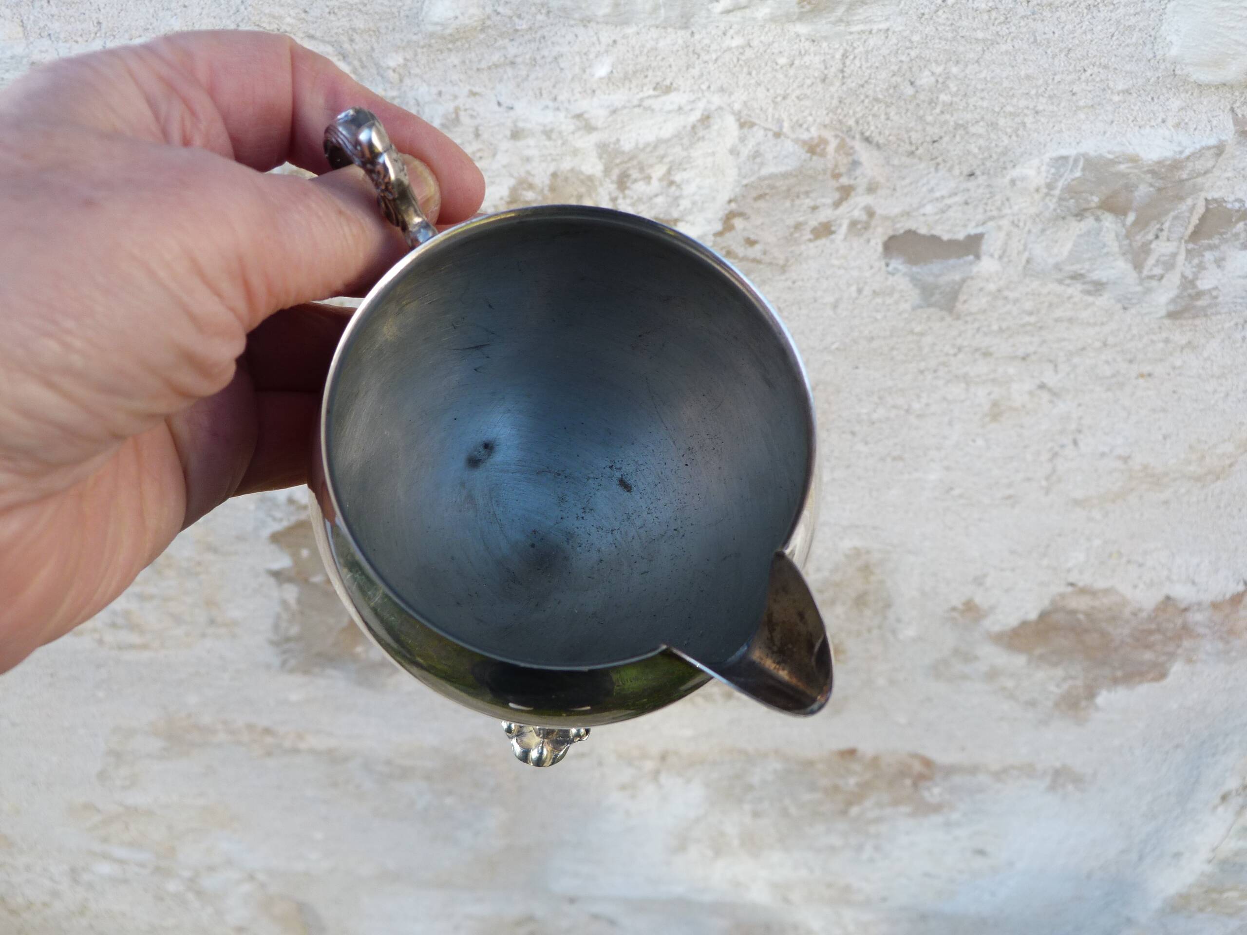 Old silver-plated metal milk or cream jug