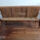 Wooden bench and rope around 1950