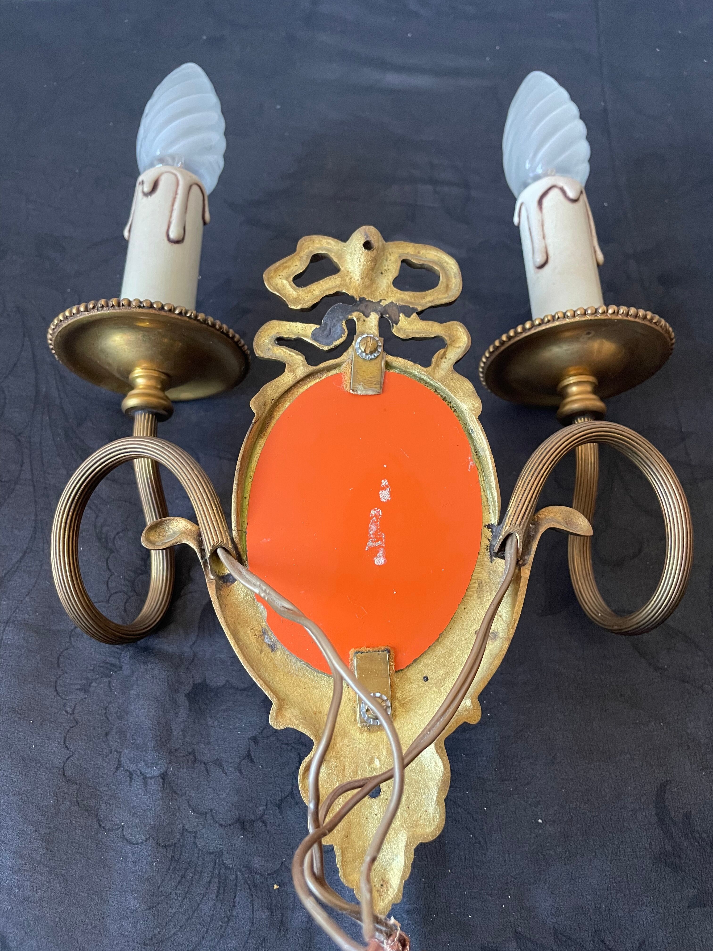 Pair of bronze wall lamps with mirror