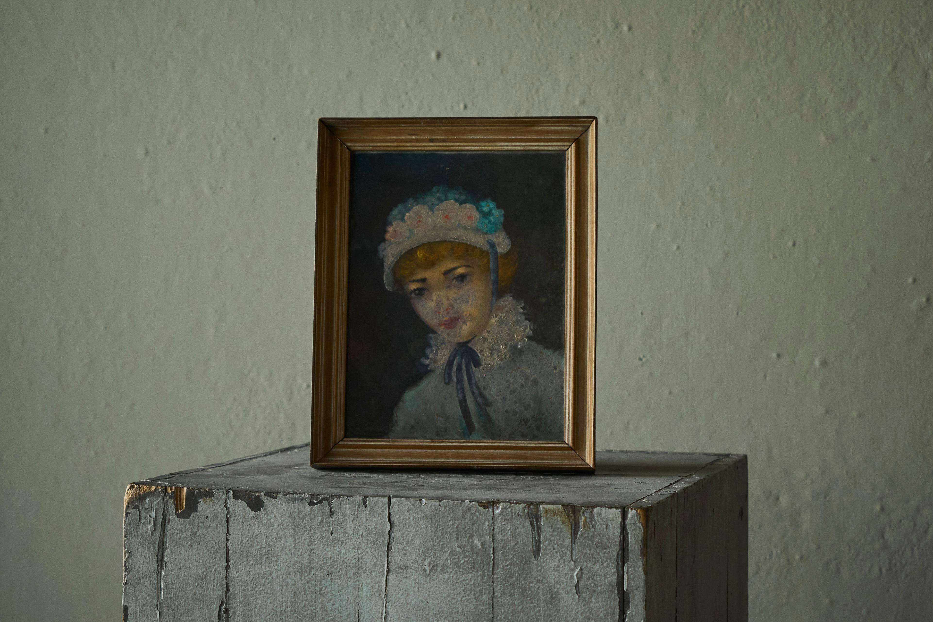 Oil portrait of a woman with a floral bonnet, Belgium, 1920s.