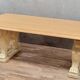 Table en pierre avec piètement à décor de protomes de lions ailés