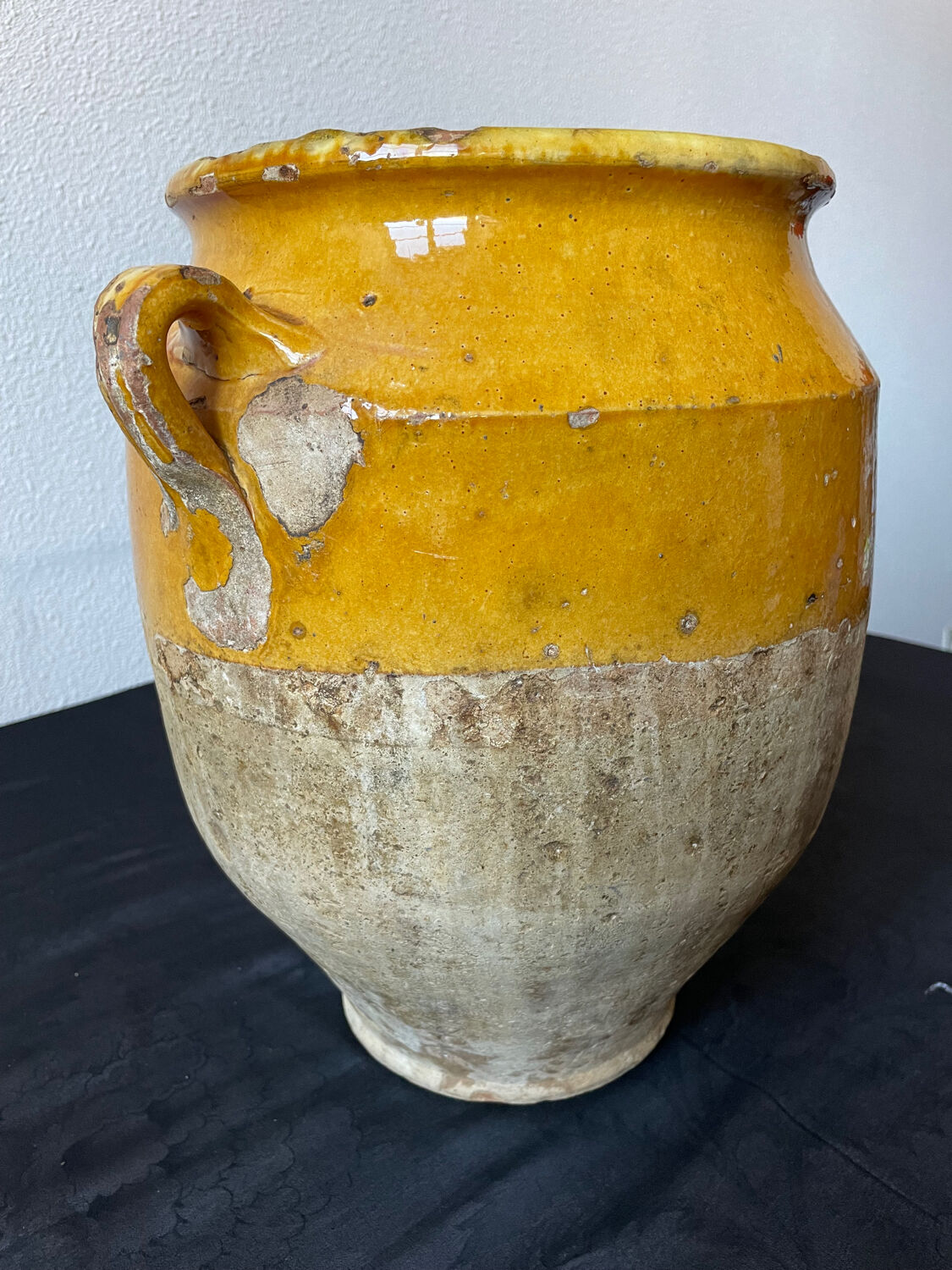 Old yellow glazed terracotta grease pot south west France