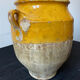 Old yellow glazed terracotta grease pot south west France