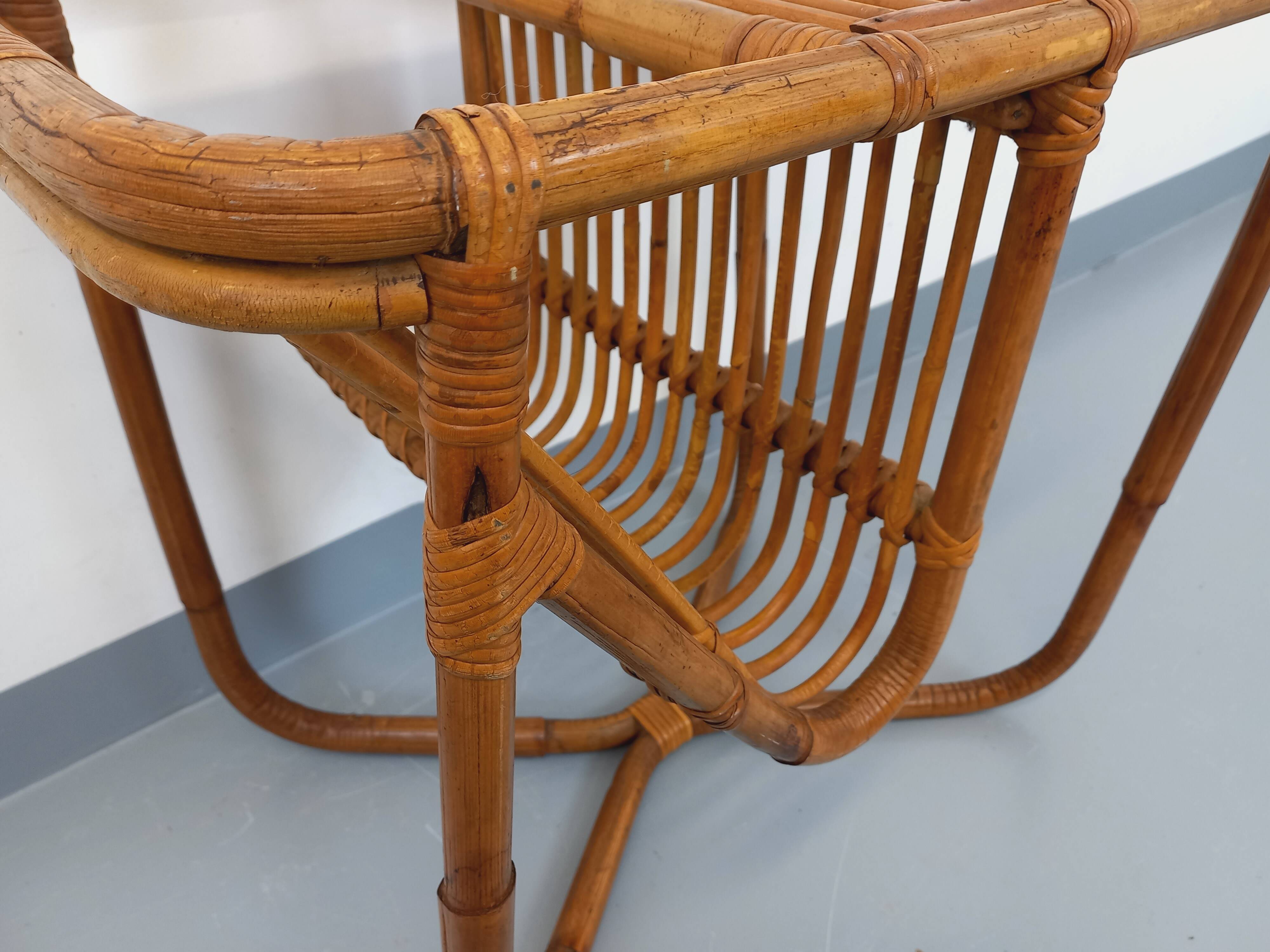 Side table / coffee table with vintage 1960s rattan magazine rack.