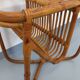 Side table / coffee table with vintage 1960s rattan magazine rack.