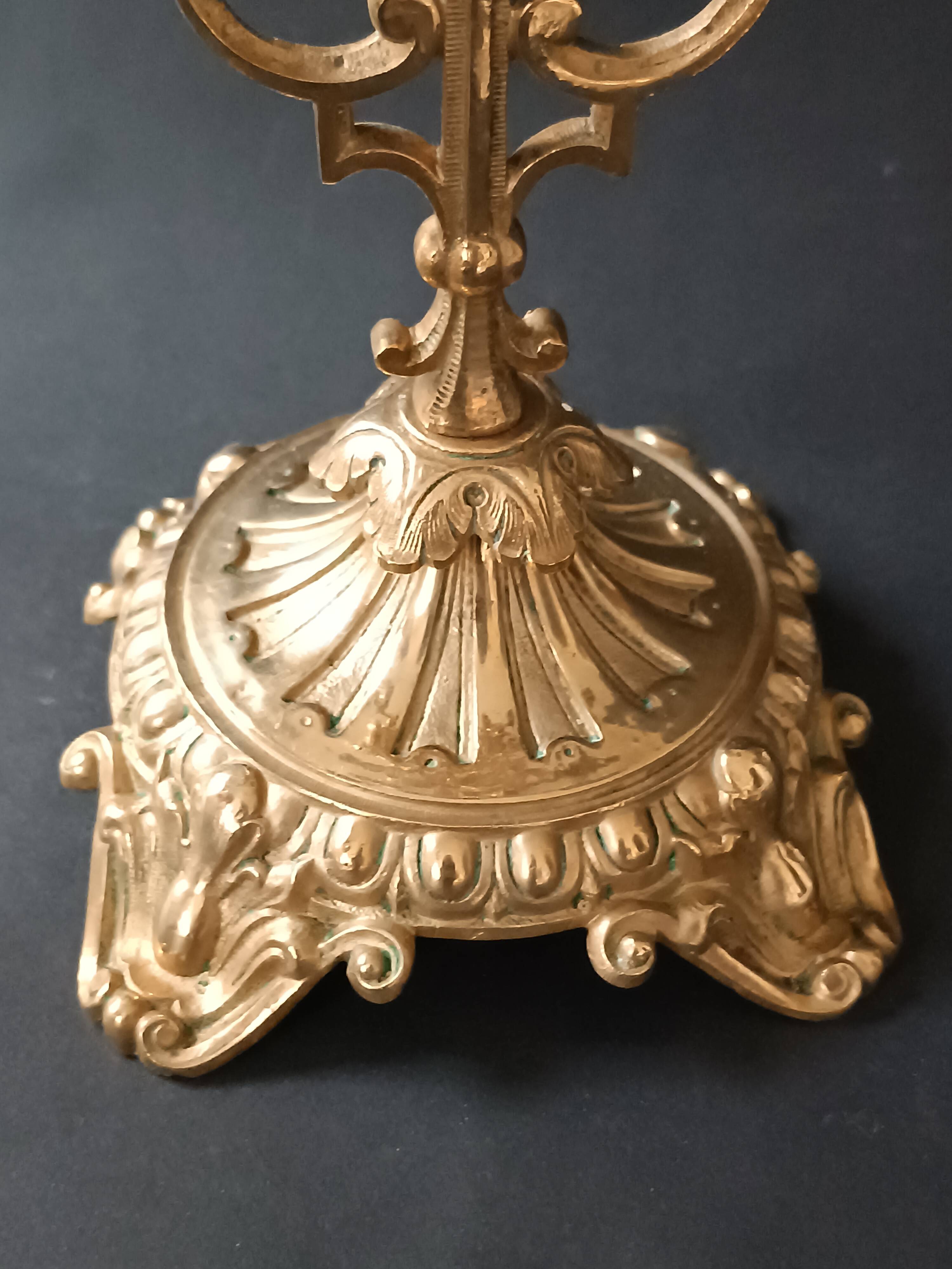 Antique three-light openwork brass church candelabrum.