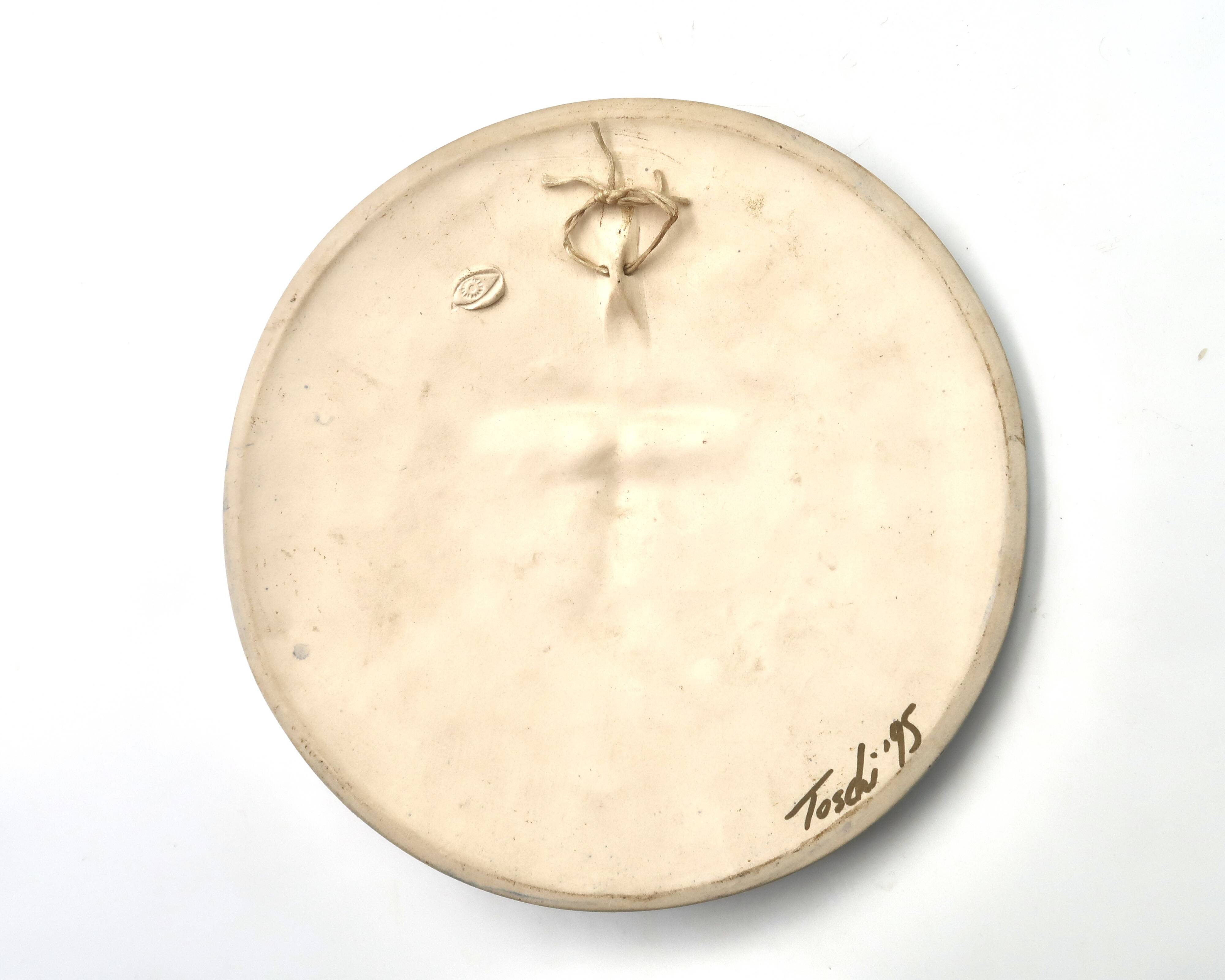 Relief mural signed in ceramic, sun with blue and gold face, 1990s.