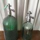 Large siphon origin Romania in glass with mesh body.