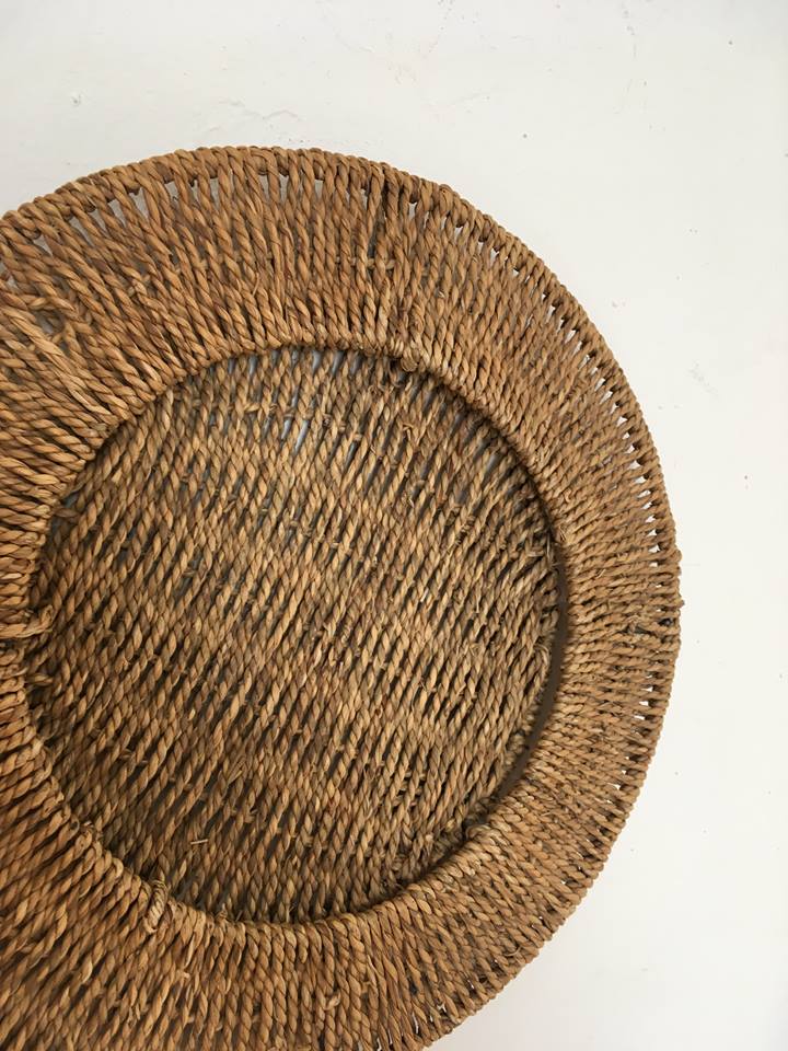 Wall composition of seven baskets and wicker trays