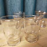 Set of 9 old glasses with golden net