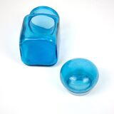 Bottle of pharmacy with screw lid in blue thick glass