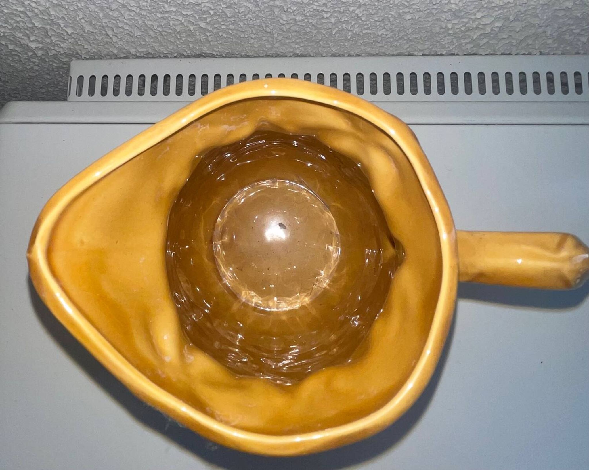 Antique pitcher with flower decoration