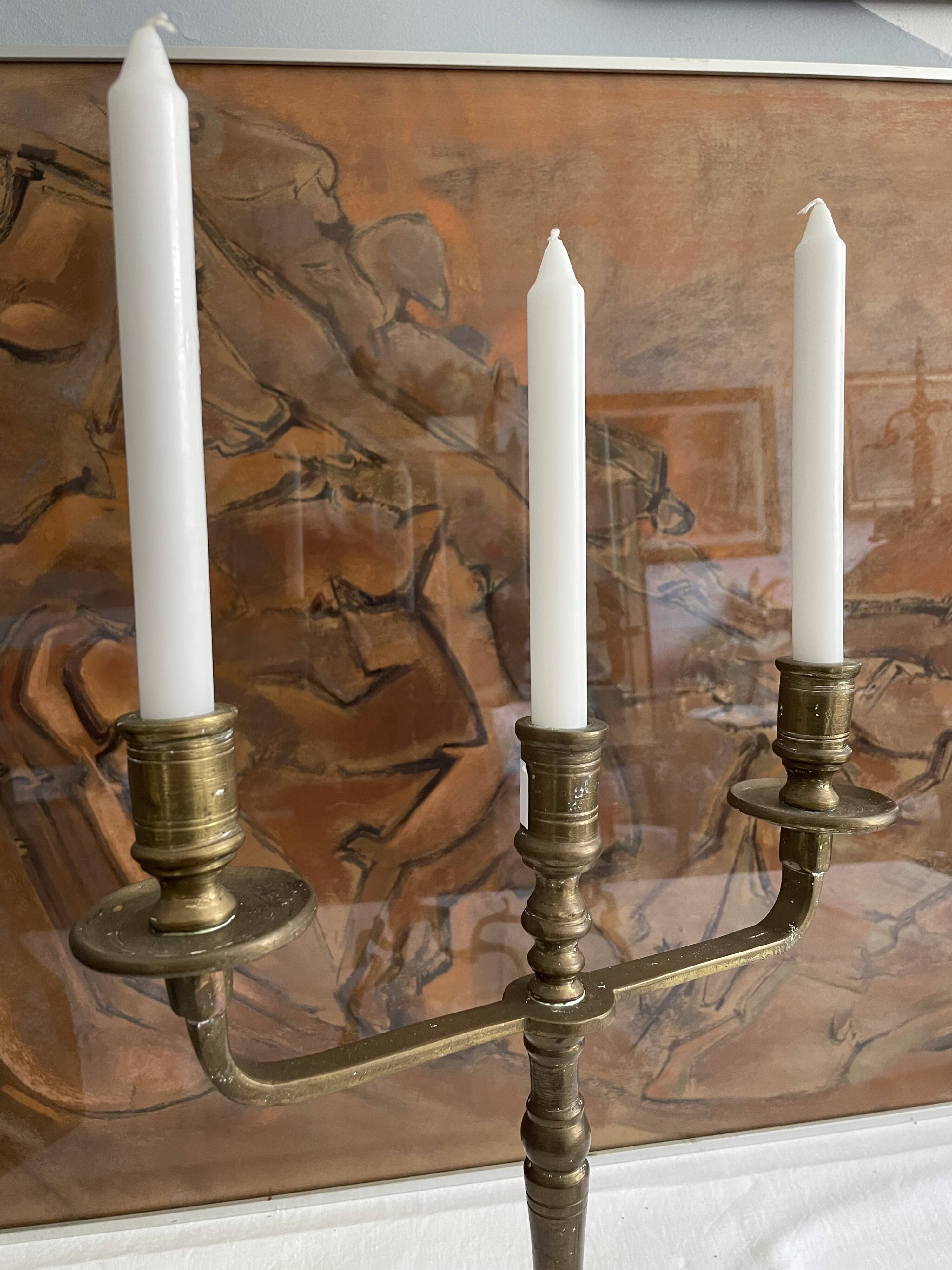 Pair of 3-spoke brass candlesticks