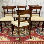 Set of 2 armchairs and 6 English mahogany chairs from the 1950s.