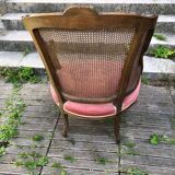 Louis XV style walnut and cane armchair