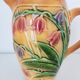 Pichet orangé fleurs en relief