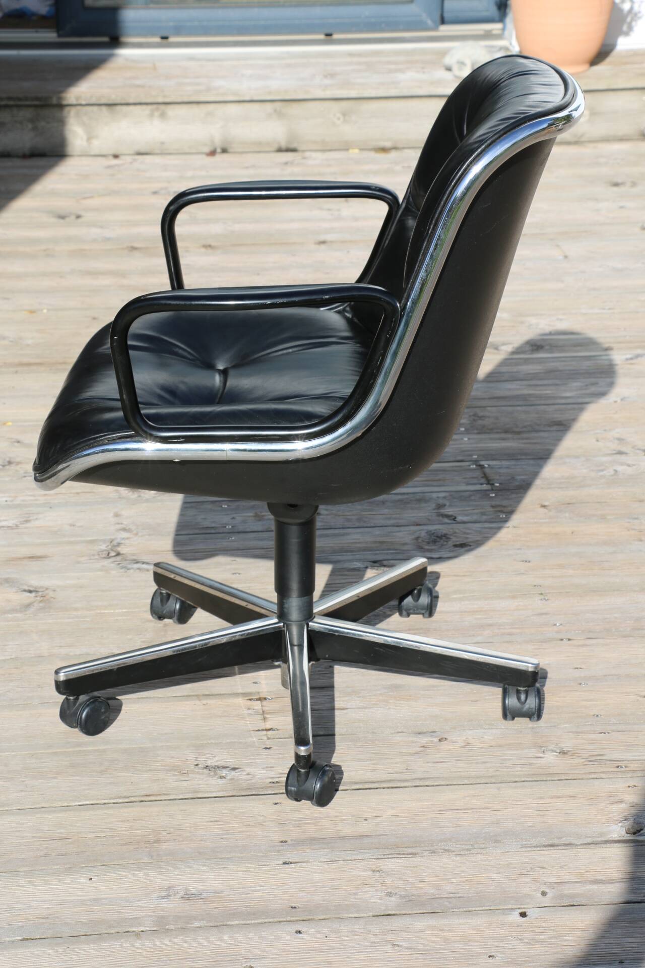 POLLOCK black leather reclining armchair with casters