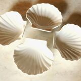 4 antique cups in the shape of a white porcelain shell
