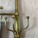 Large brass coat hook, circa 1900