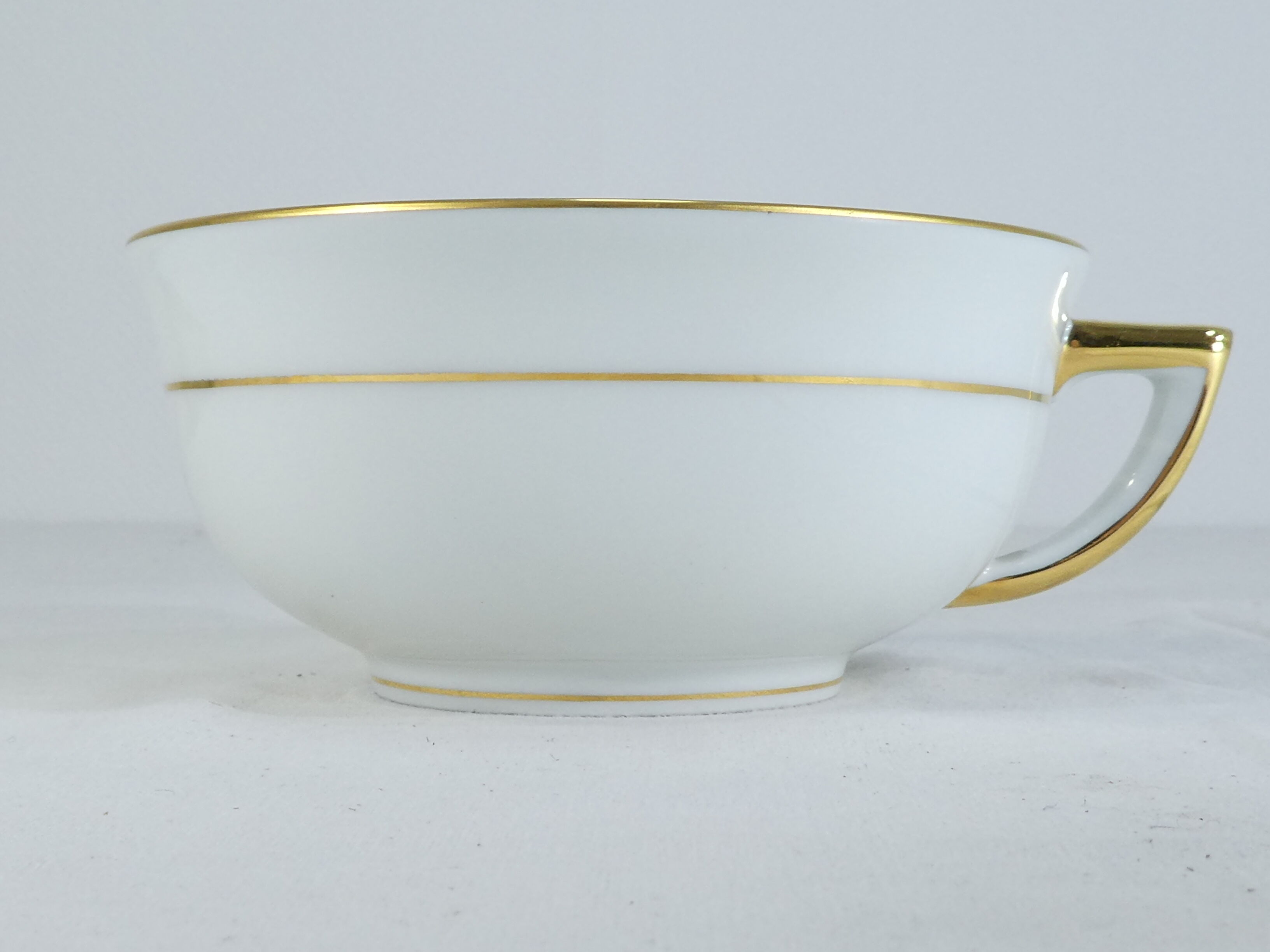 Green and gilded LIMOGES porcelain cup and cup lunch