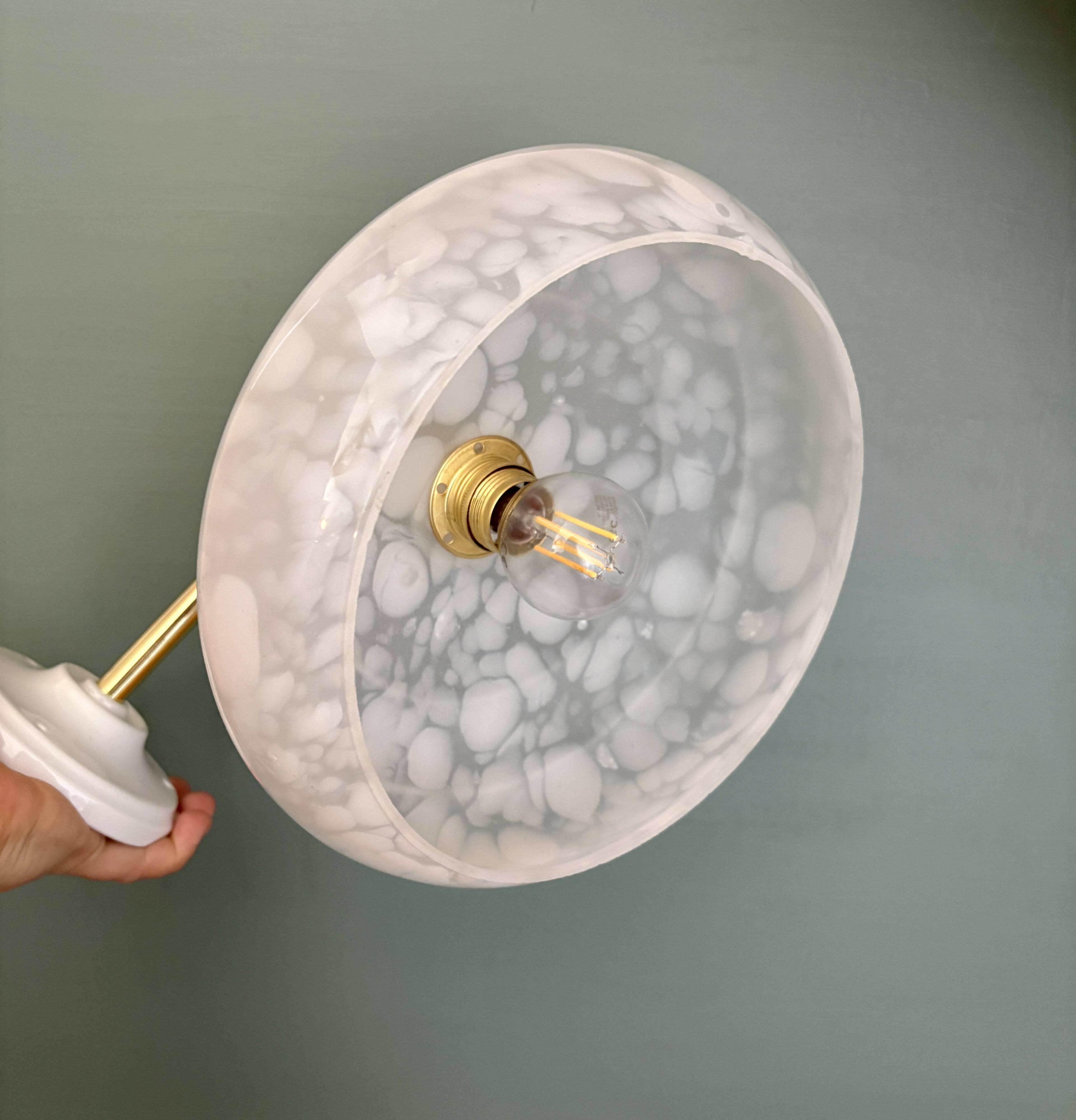 Vintage glass wall lamp with a white Clichy shade.