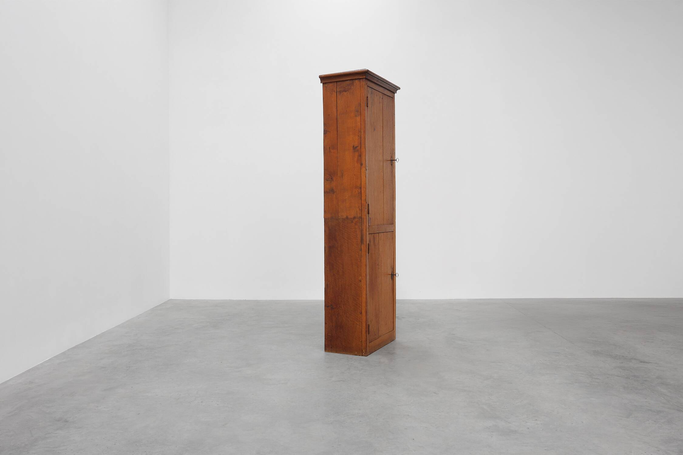 Tall rustic French monastery wardrobe in oak from the late 19th century