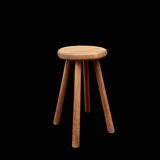 Antique solid wood four-legged stool – rustic & decorative piece