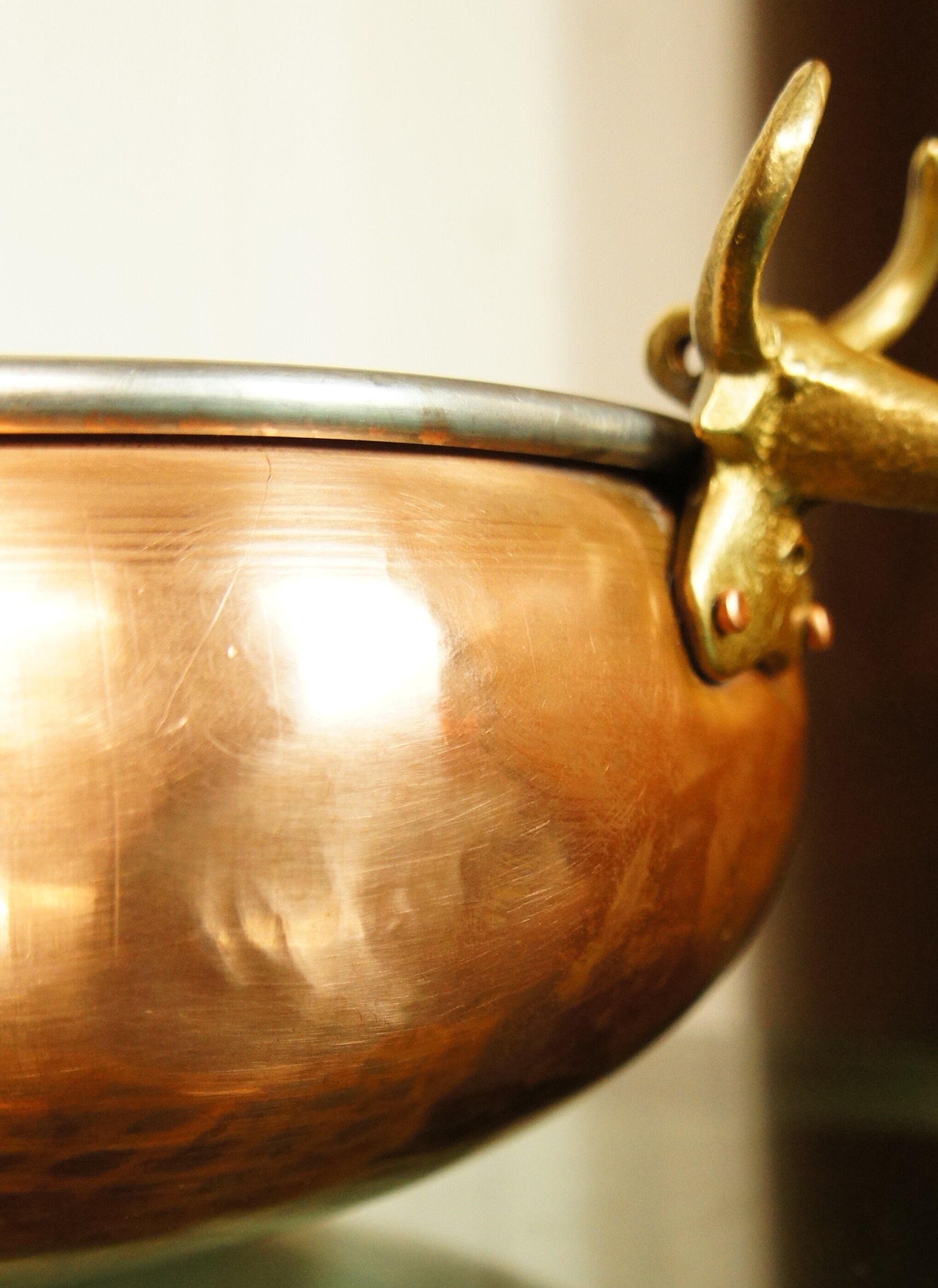 Copper cauldron with golden bronze bull heads