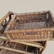 Small storage unit / freestanding shelf in light rattan.