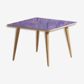 Square coffee table with glossy blue laminate top on solid oak compass legs