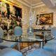 Table ghibli en verre avec 8 chaises parisiennes pieds sabrés roche bobois